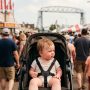 Baby relaxing in a shaded stroller at a Duluth fair