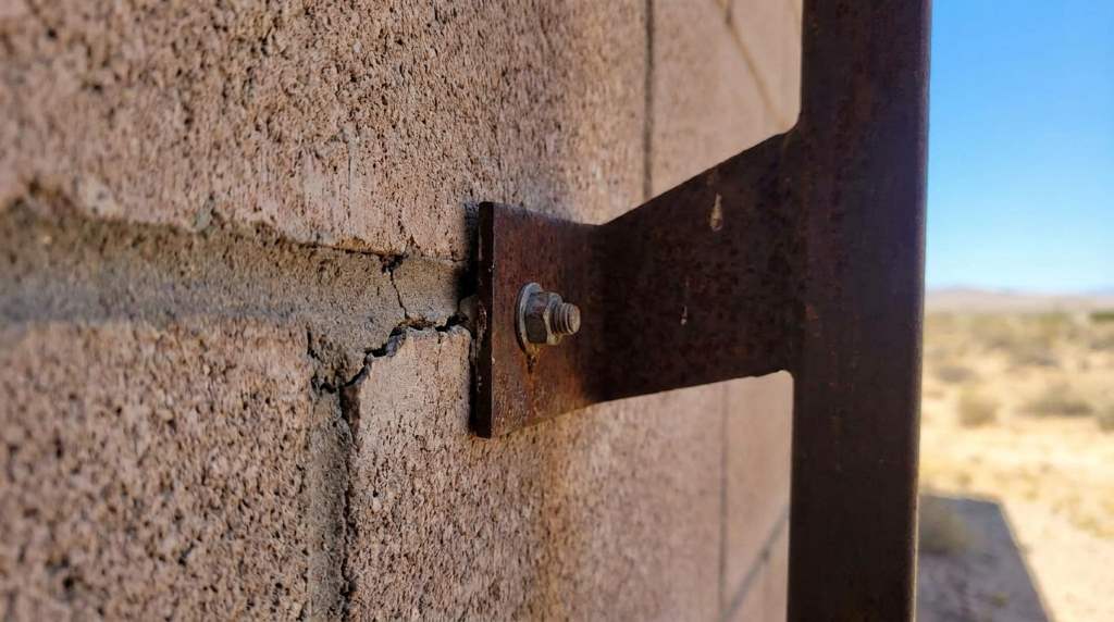 Inspecting masonry garage anchors for heat damage