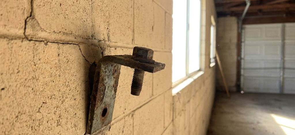 Loose masonry garage mount anchor in Phoenix garage
