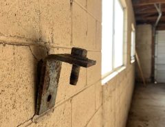 Loose masonry garage mount anchor in Phoenix garage