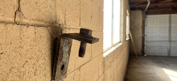Loose masonry garage mount anchor in Phoenix garage